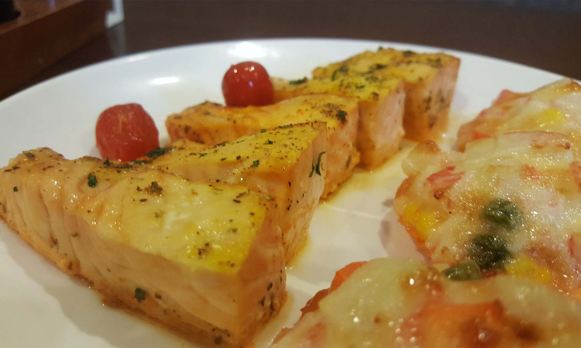 baked salmon topped with cherry tomato